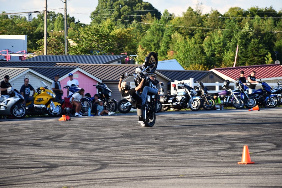 Wheelie down the straightaway during the stunt show at Bike Night at Eats on 601 in Mocksville NC