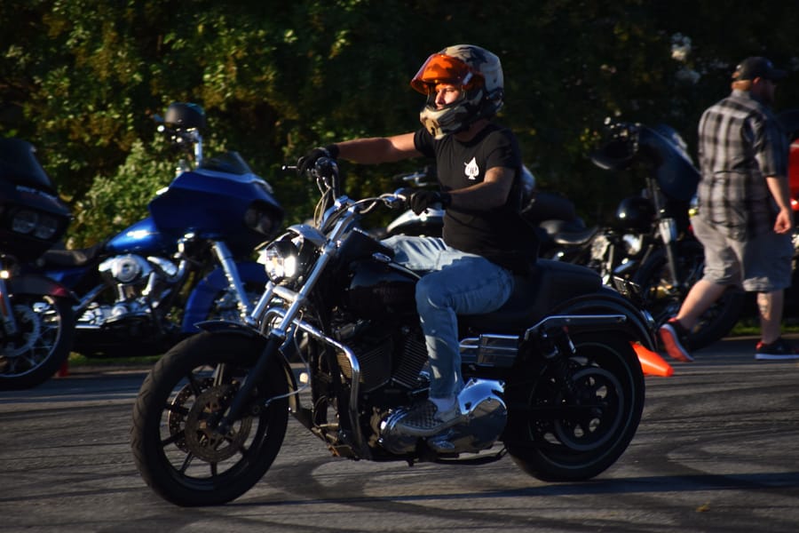 Riders talking between the rows at the Eats on 601 Bike Night in Davie County