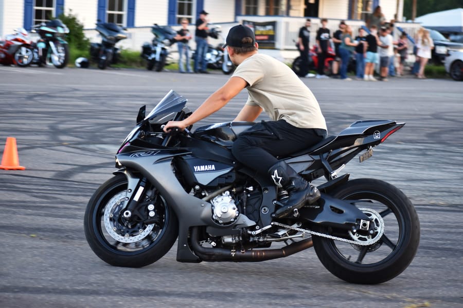 Stunt rider with the front wheel up at the Eats on 601 Bike Night
