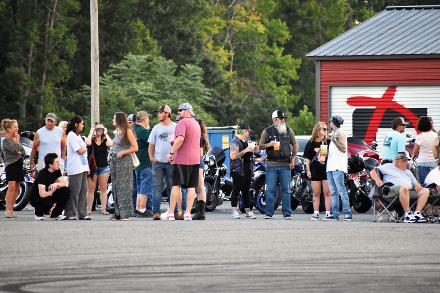 People posted up in chairs at Bike Night on Highway 601 in Mocksville NC