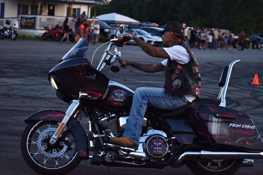 Rider hanging out by his bike at Bike Night at Eats on 601 in Mocksville NC