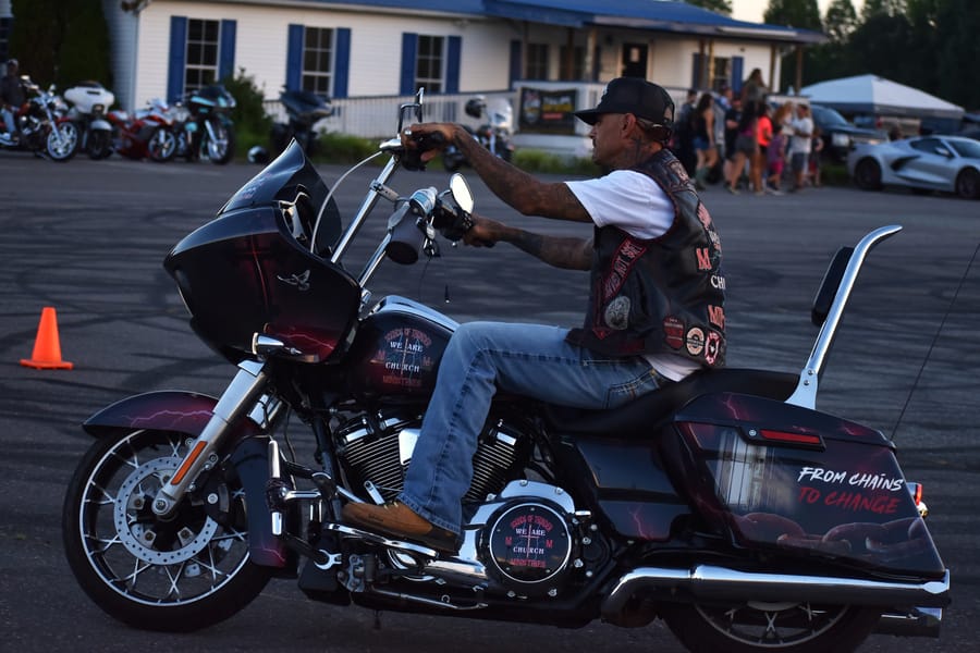 Riders talking between the rows at the Eats on 601 Bike Night in Davie County