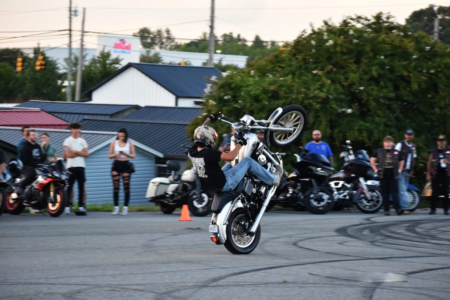 Stunt rider with the front wheel up at the Eats on 601 Bike Night