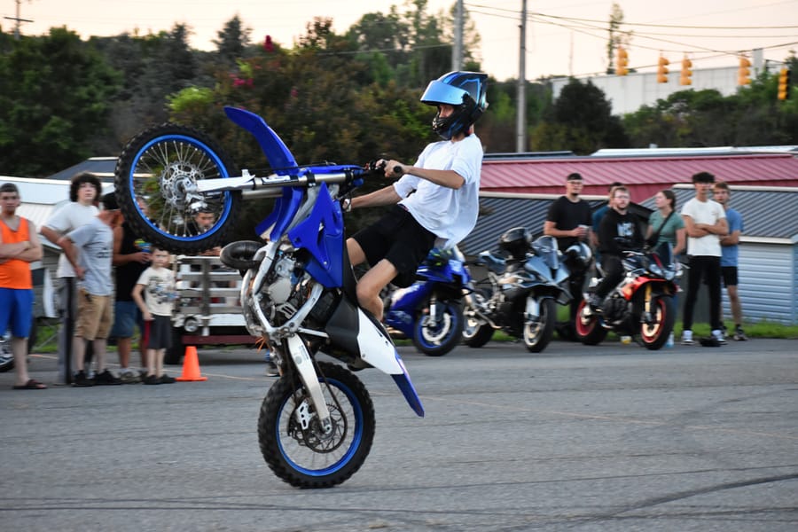 Stunt rider with the front wheel up at the Eats on 601 Bike Night