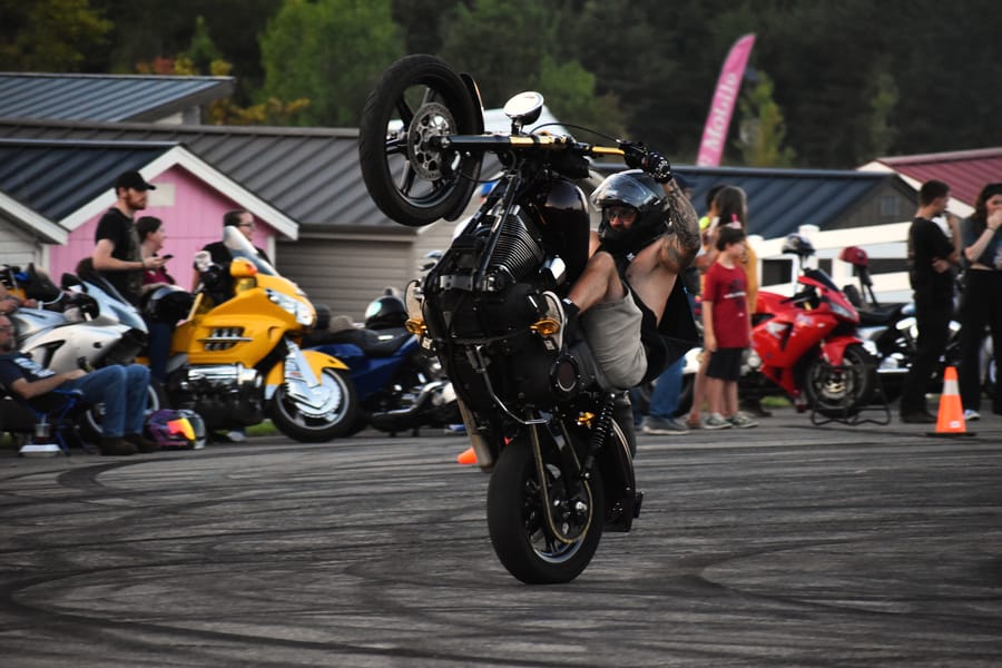 Wheelie down the straightaway during the stunt show at Bike Night at Eats on 601 in Mocksville NC