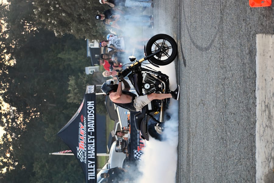 Stunt rider with the front wheel up at the Eats on 601 Bike Night
