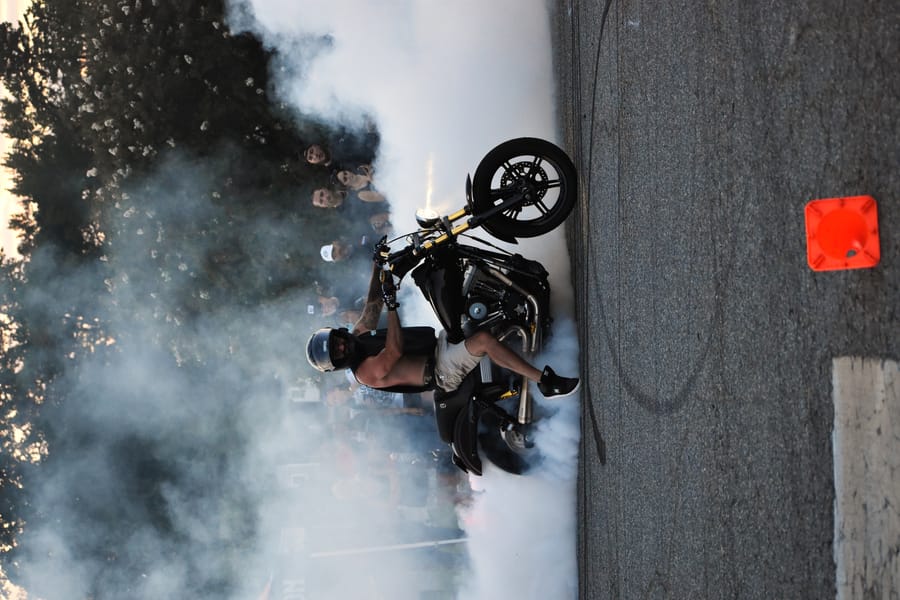 Wheelie down the straightaway during the stunt show at Bike Night at Eats on 601 in Mocksville NC