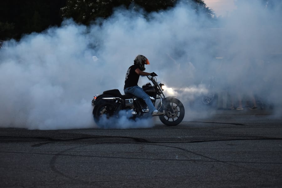 Stunt rider with the front wheel up at the Eats on 601 Bike Night