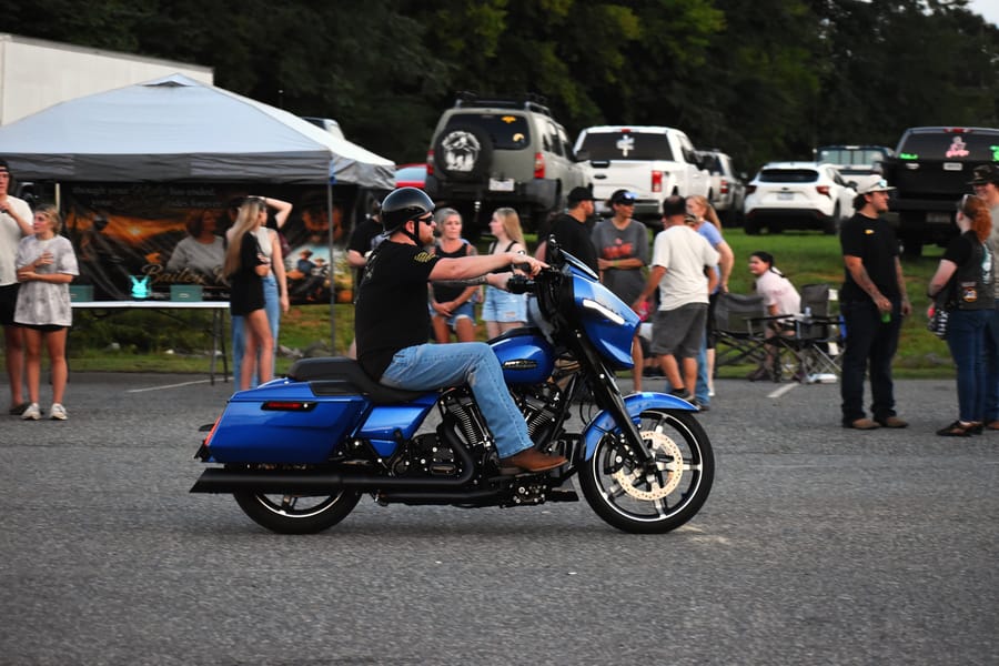 Riders talking between the rows at the Eats on 601 Bike Night in Davie County