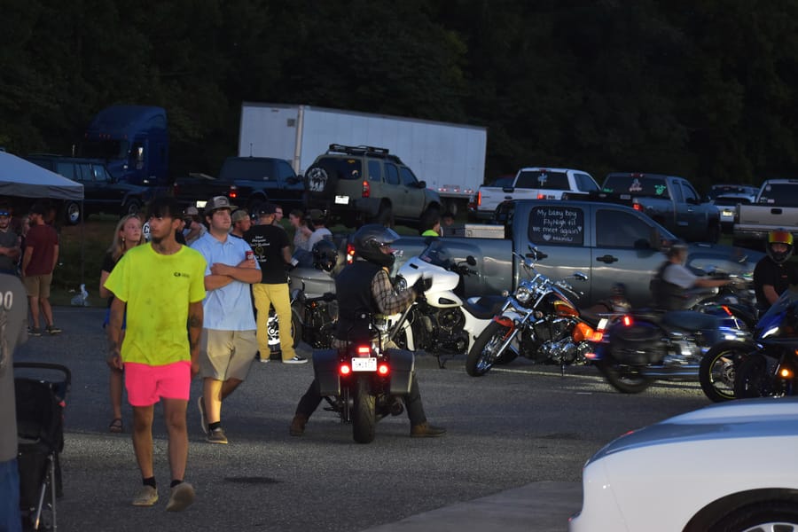 People posted up in chairs at Bike Night on Highway 601 in Mocksville NC