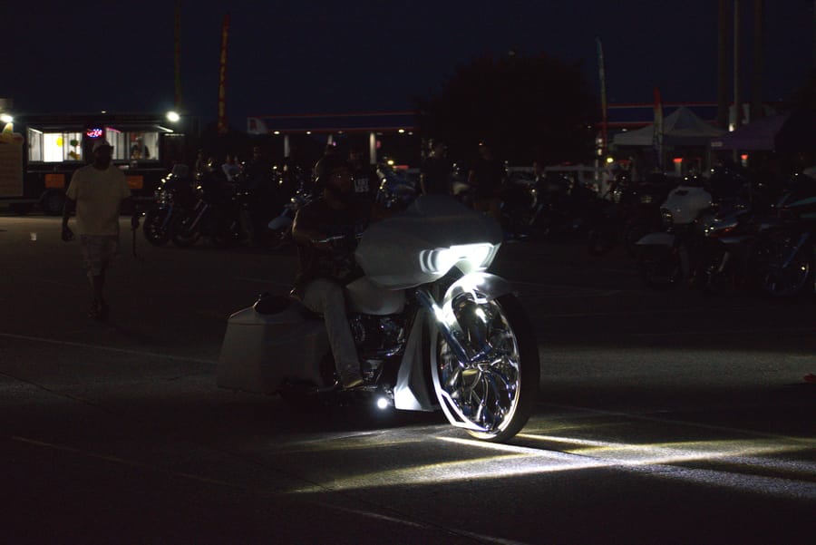 Bikes under the shop lights after dark at Bike Night at Eats on 601 in Mocksville NC