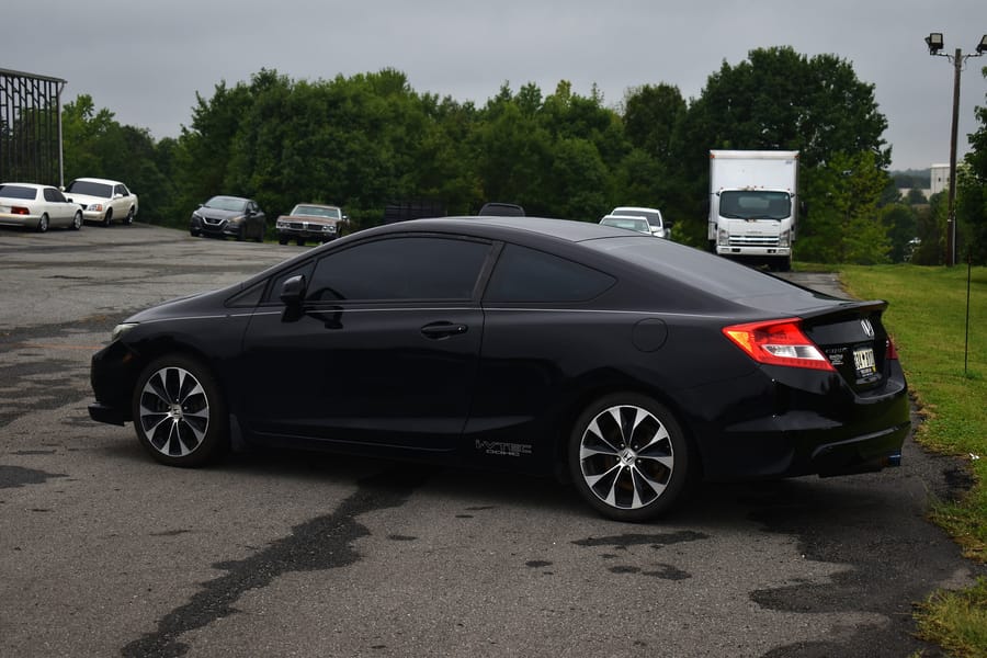 White ninth gen Honda Civic Si parked with the meet crowd at Eats on 601 in Davie County