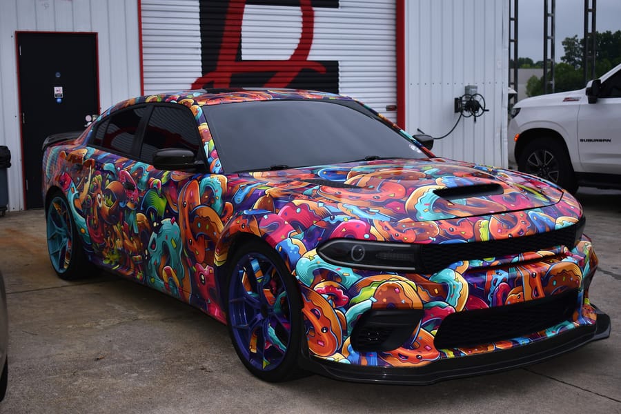 Graffiti wrapped Dodge Charger at the Friday night car meet on Highway 601