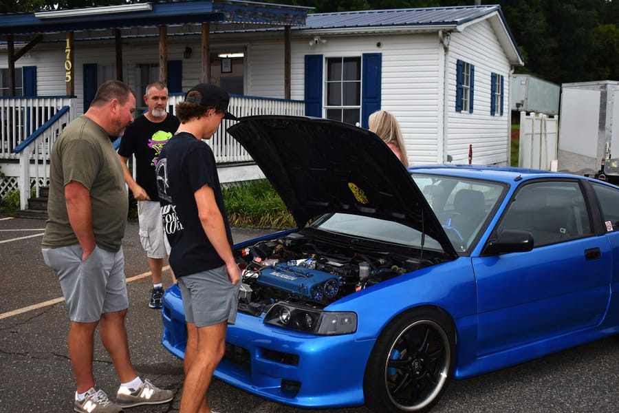Boosted blue Honda Del Sol parked at the Honda car meet at Eats on 601 in Mocksville NC