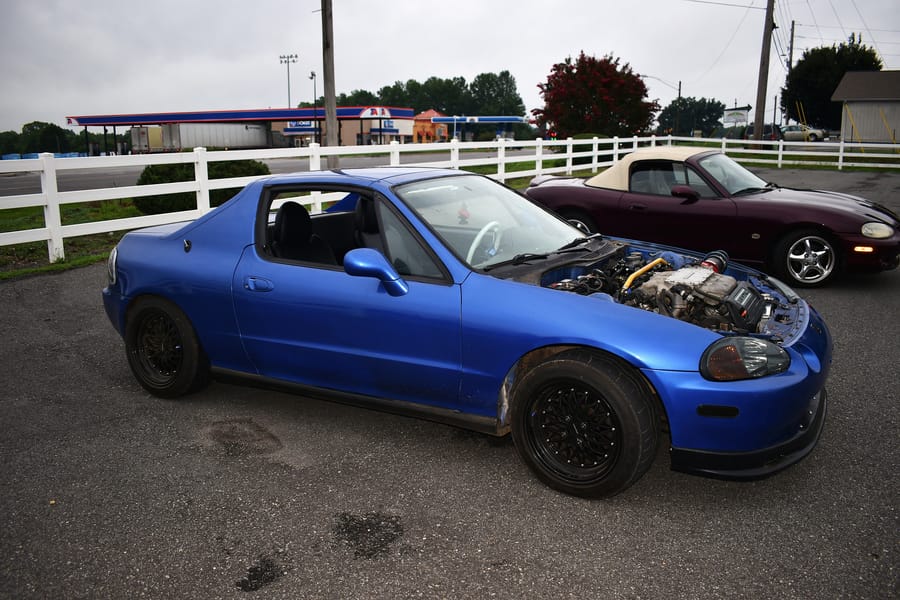Boosted blue Honda Del Sol parked at the Honda car meet at Eats on 601 in Mocksville NC