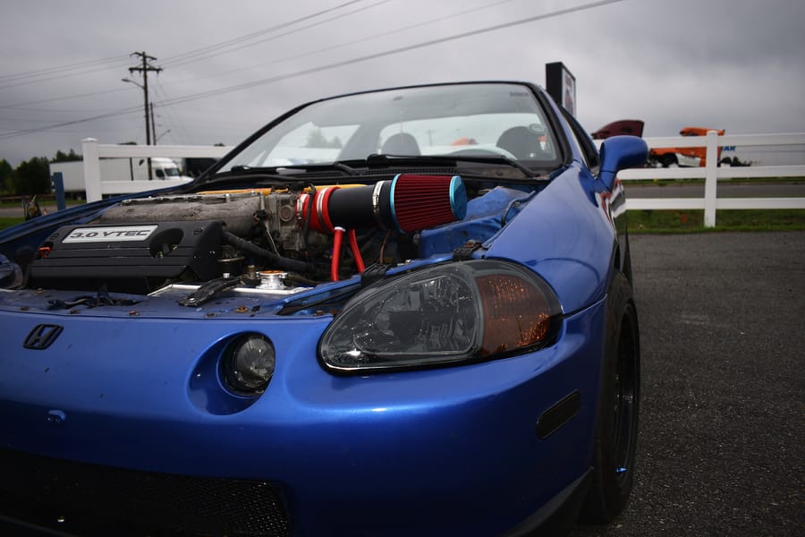 Boosted blue Honda Del Sol parked at the Honda car meet at Eats on 601 in Mocksville NC