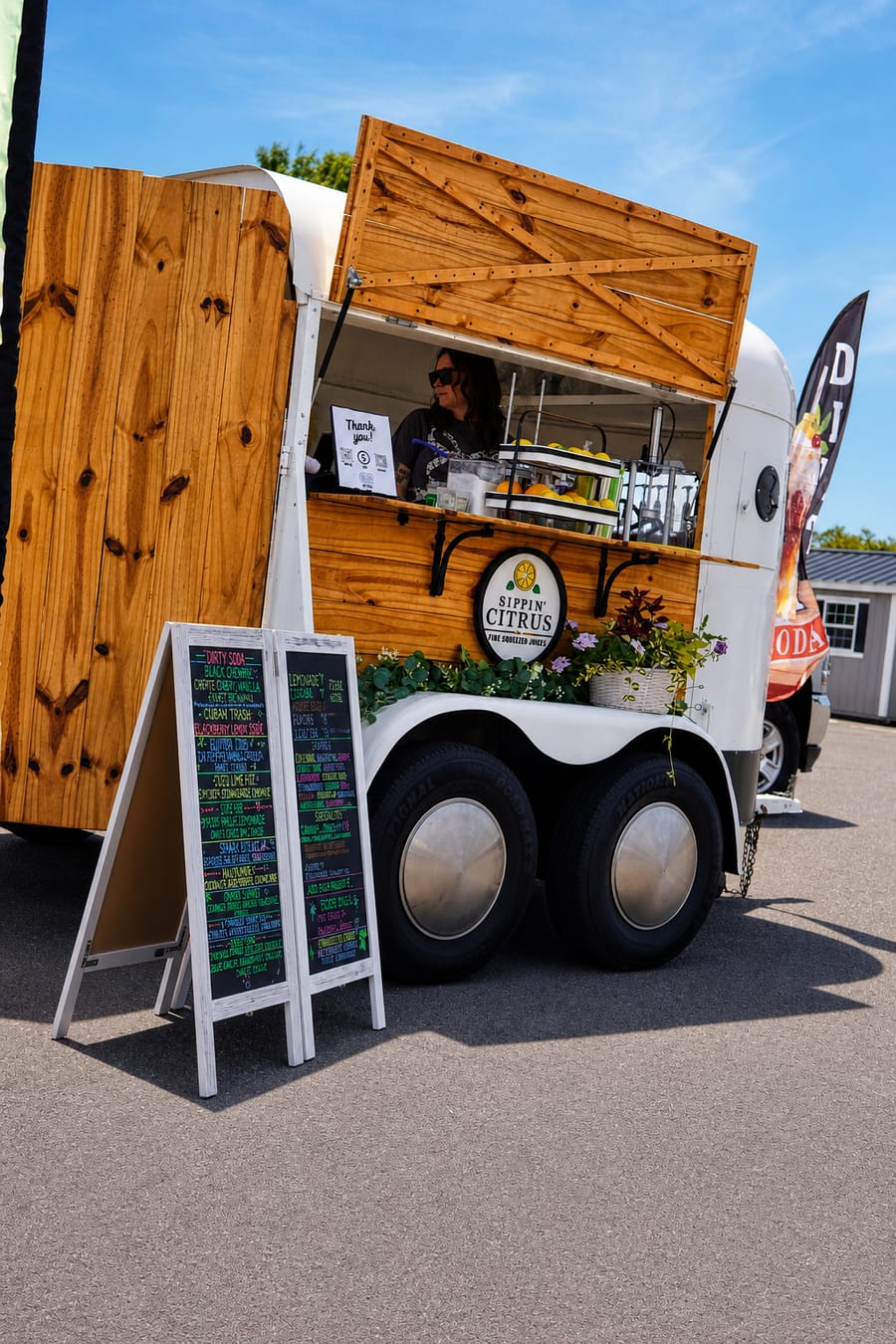 Sippin' Citrus mobile bar trailer parked up at the Jeep Jam serving drinks to the crowd.