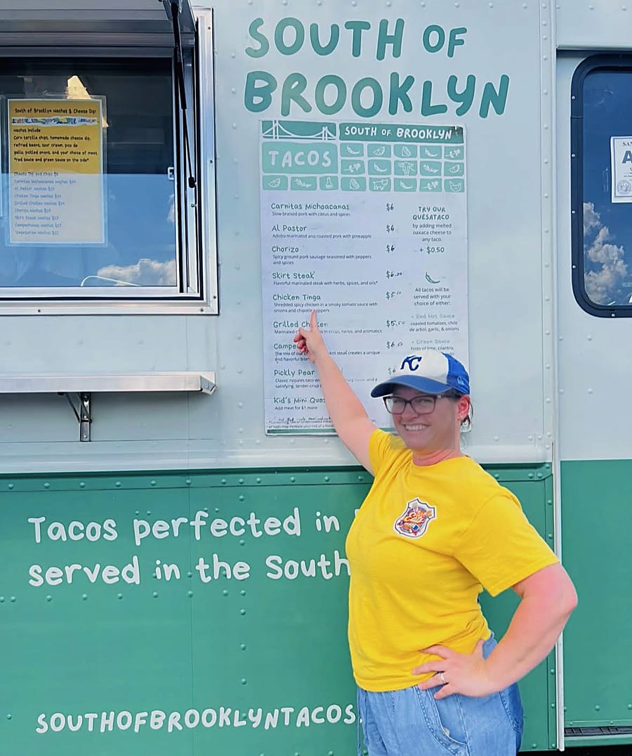 The South of Brooklyn taco truck on the lot, with the day's menu on the side