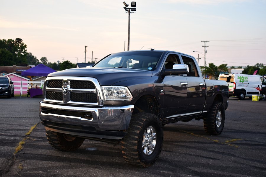 Black lifted Ram parked front three-quarter on the lot at the Eats on 601 truck meet.