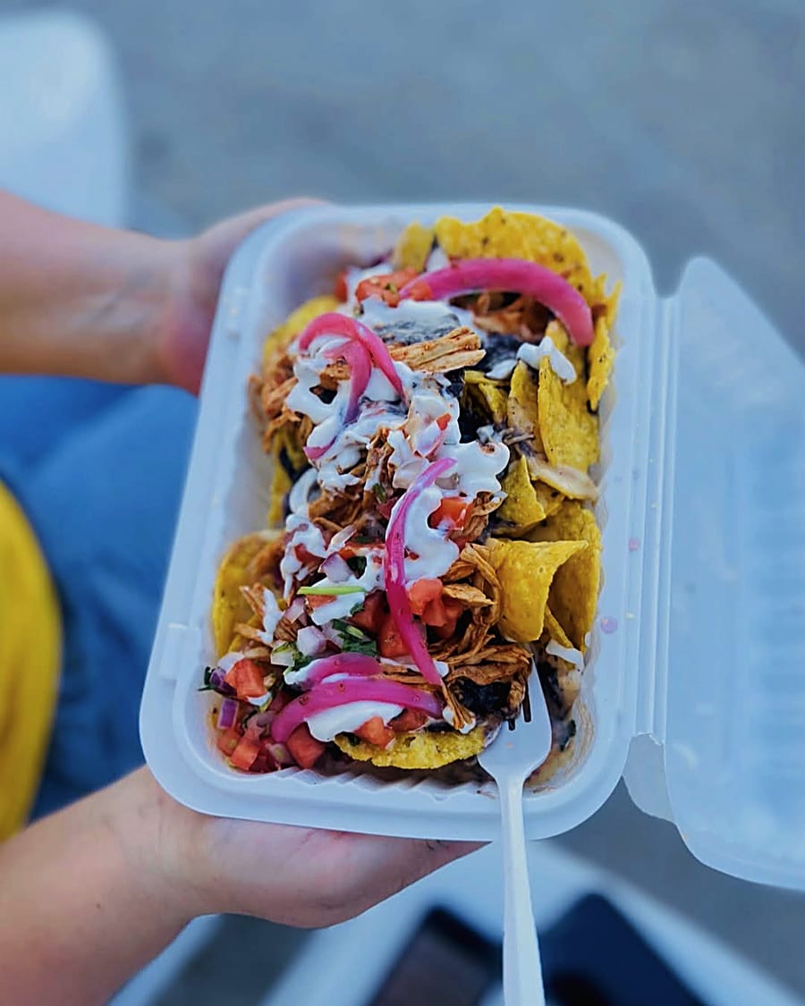 A loaded order of nachos in hand on the lot at Eats on 601 in Mocksville